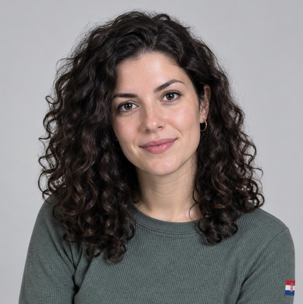 Studio portrait of a young woman with curly hair